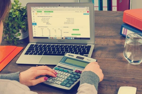 Financial paperwork beside a calculator